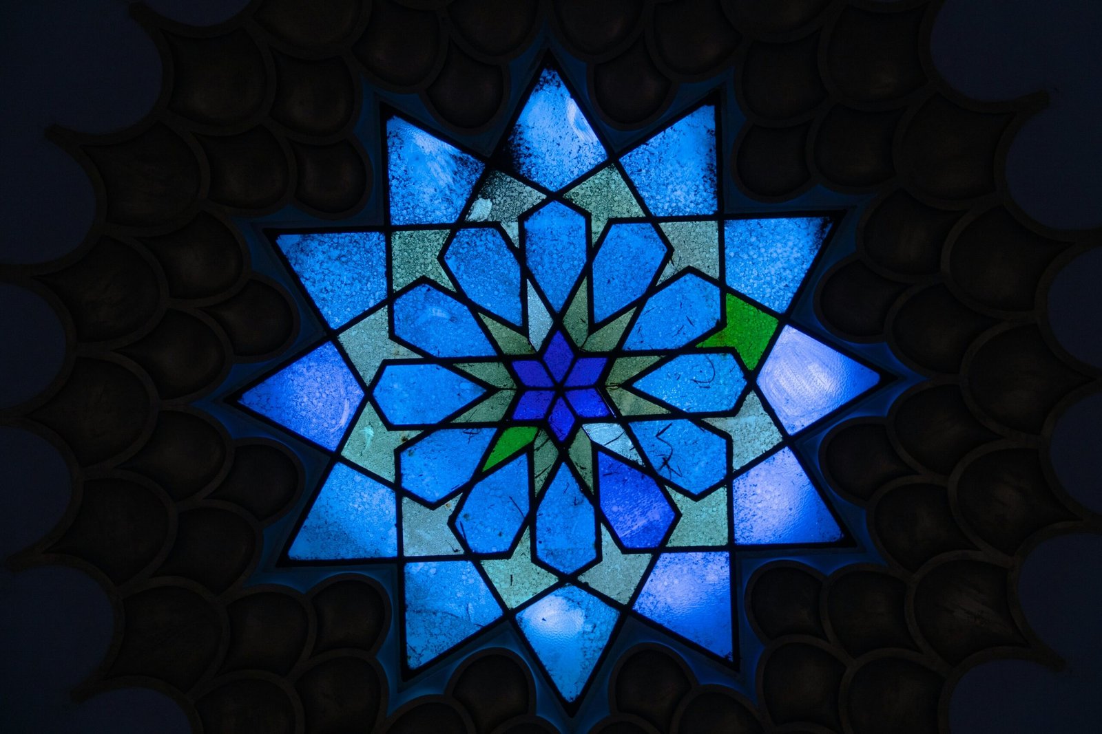 a stained glass window with a star design